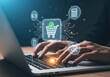 © Moshiur - Online shopping transaction concept with hands typing on laptop and digital cart icon glow.