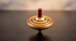 © Chanchai - A handcrafted timber spinning top rotates rapidly on a polished surface, showcasing blurred wood grain and elegant craftsmanship in motion, balance, macro, rotation