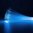 © AGUNG - Glowing blue strands of light against dark background