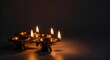 © Chanchai - Three ornate brass oil lamps glowing with warm orange flames against a dark background, celebrating the festival of lights with serenity, ornate, metallic, handcrafted