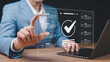 © MdAyub - Person's finger touching a holographic screen displaying a checklist with a large checkmark and house icons