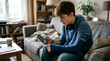 © logonv - Teenager boy with a blue cast on his arm using a smartphone while sitting on a couch. Injured student relaxing at home. Recovery, healthcare, medical treatment and leisure lifestyle concept.