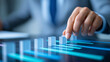 © Nataliya - Close-up of a business hand moving a Q block along a digital chart timeline, project scheduling concept, business milestone management, strategic execution visualization,