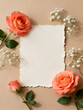 © wowyoung - Elegant corral pink roses and blank paper on beige background
