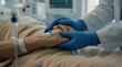© abdelaziz - Bedside Comfort: Medical Professional Supporting Senior Patient