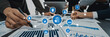 © InfiniteFlow - A diverse business team collaborates in an office setting, analyzing data charts and graphs, utilizing technology connections to enhance project management strategies. Amity