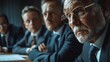 © IvyBridge - In the conference room, businessmen are intently discussing business plans