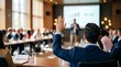 © haemye - Diverse business team in a meeting room, with one man raising his hand to ask a question. Concept for strategic planning, collaborative environment and corporate workshop