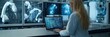 © Ilja - Female Engineer Programming Advanced Robot Manufacturing System in High-Tech Factory Environment
