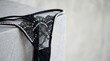 © abc123man - Sensual lingerie display elegant studio photography romantic setting close-up view lace & pearls