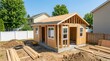 © Masque - A small accessory dwelling unit being built in a suburban backyard.
