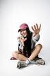 © wedmoments.stock - Female model in fashionable streetwear inspired outfit on isolated background. Concept modern trends and confidence.