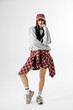 © wedmoments.stock - Modern woman posing in trendy casual retro styling on isolated white background. Concept fashion campaign and urban mood.
