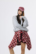 © wedmoments.stock - Stylish female model in urban casual fashion look on isolated white background. Concept street fashion and lifestyle identity.
