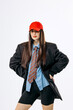 © wedmoments.stock - Stylish female model posing in contemporary fashion outfit on isolated white background. Concept street fashion and self expression.