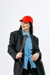 © wedmoments.stock - Fashion model in stylish business-inspired outfit posing on white background. Concept modern fashion, confidence and creative style.