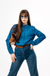 © wedmoments.stock - Fashion model in shirt and jeans posing on clean white studio background. Concept casual fashion, confidence and minimalist style.
