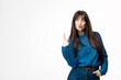 © wedmoments.stock - Fashion model pointing upward with one finger on white studio background. Concept presentation, advertising and copy space.