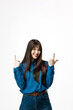 © wedmoments.stock - Young woman pointing up with both hands on isolated white background. Concept announcement, promotion and attention.
