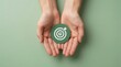 © Sukon - Business success future plan concept featuring hands holding a target icon.