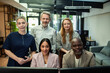 © Davor - Portrait of diverse colleagues at computer monitors in modern office