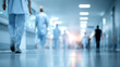 © Subin - Healthcare professionals walking in a modern hospital corridor, showcasing teamwork and dedication in medicine.