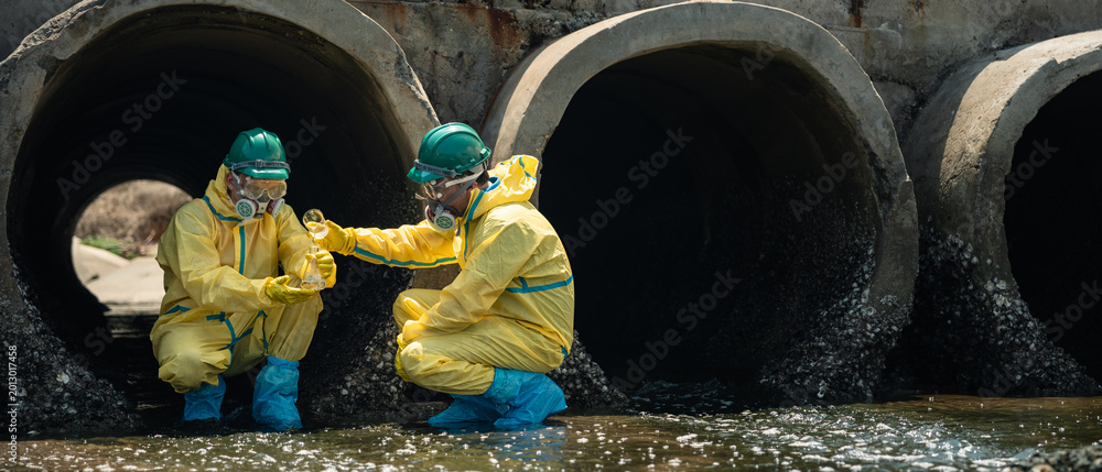 Environmental Workers Inspecting Polluted Wastewater Drainage Tunnel In ...