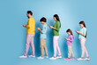 © deagreez - Family walking in line using smartphones, parents and children absorbed in mobile screens, modern digital lifestyle and generational tech habits on a blue background