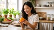 © Vasiliy - Happy young Asian woman holding fresh orange in kitchen. Cheerful female with citrus fruit and vegetables. Healthy lifestyle and nutrition concept