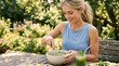 © Vasiliy - Young woman whisking a green smoothie in a sunny garden. Healthy lifestyle and wellness concept. Female preparing a nutritious drink outdoors on a wooden table