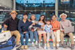 © Verin - happy multi-generation family with suitcases waiting for flying in the airport terminal, concept family lifestyle,bonding,travel,destination,airline travel