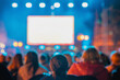 © svetlanais - Rear view of blurred crowd watches large screen at night outdoor event with lights, bokeh, people silhouettes. Concept of screen advertising, cinema, festival, presentation, entertainment, copy space
