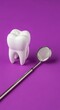 © Latsamee - A clean white anatomical tooth model sits next to a professional stainless steel dental mirror on a vibrant solid purple background surface, oral, tooth, plastic