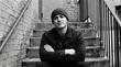 © Влада Яковенко - Young man posing on stairs with arms crossed, black and white portrait with confident attitude and urban character, grainy analog style, realistic detail, no logos