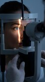 Ophthalmologist's Day : An eye examination with a slit lamp by an ophthalmologist, focusing on the patient's eye
