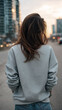© Createya - Young caucasian female in casual attire walking in urban street at sunset with cityscape view—concept for fashion brands, urban lifestyle magazines, travel blogs