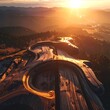 © Kudu - Aerial view of highway interchange at sunset.
