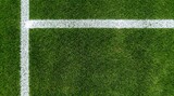 Down view of green soccer pitch grass with white painted boundary lines forming corner intersection for sports field texture and athletic background