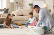 © Pixel-Shot - Father suffering from burnout with laundry and his little children at home