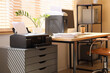 © Pixel-Shot - Modern workplace with shredder, documents and printer near window in office