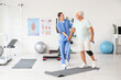 © Pixel-Shot - Senior man with crutches and therapist walking in rehabilitation center