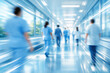 © Rohan Katwe - Modern hospital corridor with doctors and nurses walking in motion blur, bright natural light, clean clinical environment, symbolizing healthcare, emergency care, medical teamwork hospital efficiency