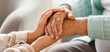 © Pixel-Shot - Senior woman with daughter holding hands at home, closeup
