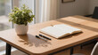 © MARVIN - Open Notebook, Pens, and Potted Plant on Wooden Desk with Sunlight
