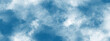 © MDRobin - Vibrant colorful watercolor wash background with soft cloud textures and artistic ink bleeds for creative digital design cloudy textured background with white fluffy clouds.