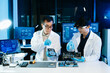© Nuttapong punna - Asian engineers and scientists working with computer hardware, AI systems and digital technology