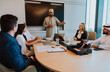 © oneinchpunch - Diverse business team meeting in modern office