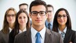 © Ty - A group of business professionals standing together in a professional setting.