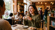 © Vector Vision - Woman laughing and enjoying wine with friends at a cozy restaurant table