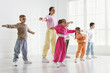 © New Africa - Professional dance teacher training children in studio